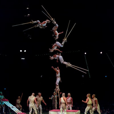 Acrobats performing tricks
